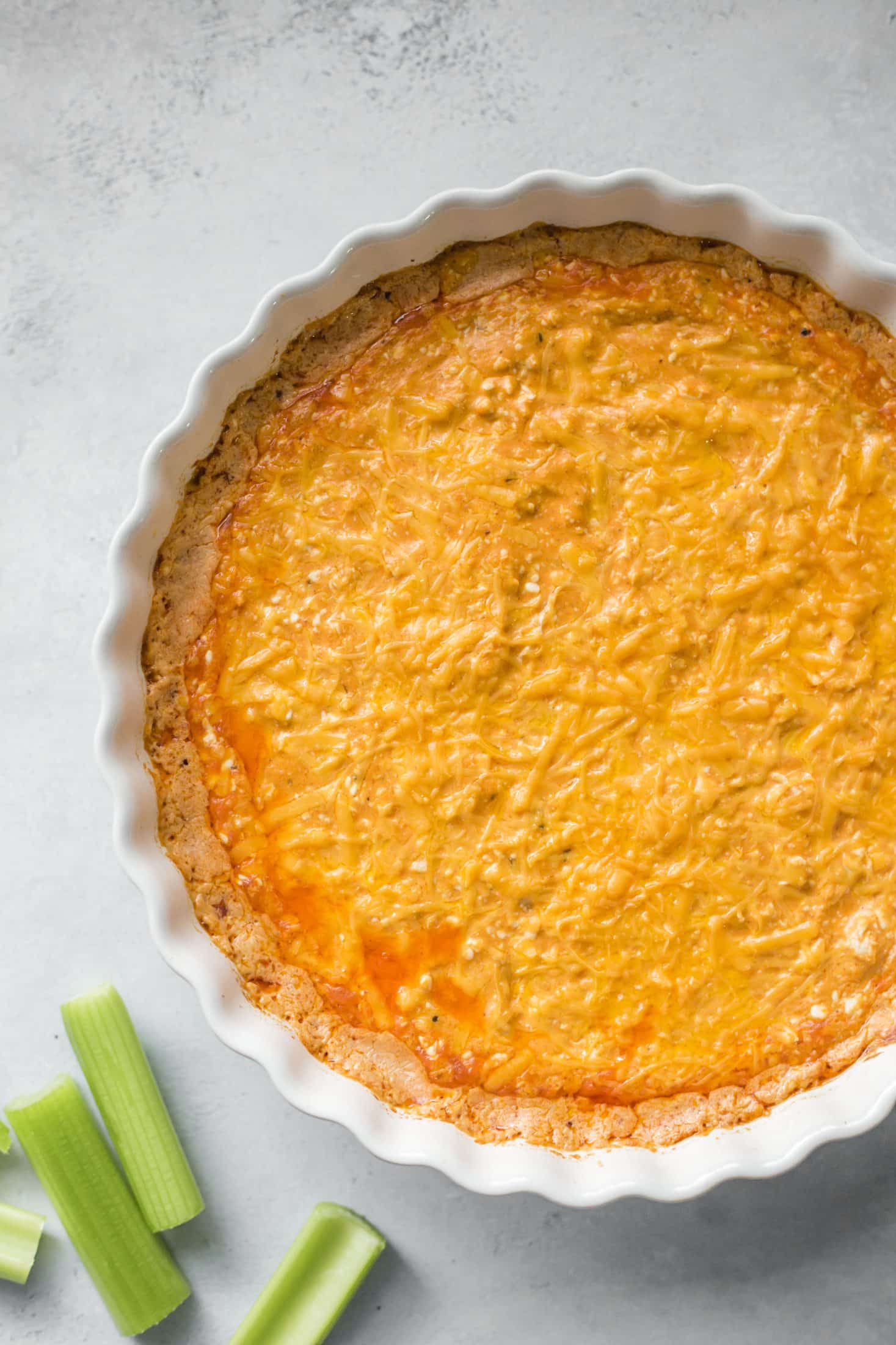 This is the best buffalo chicken dip recipe! Creamy, cheesy, slightly spicy and full of delicious chicken and flavors. Perfect for tailgating, football games, parties and weekends. This recipe is classic and super easy to make. I howsweeteats.com #buffalo #chicken #dip #recipe