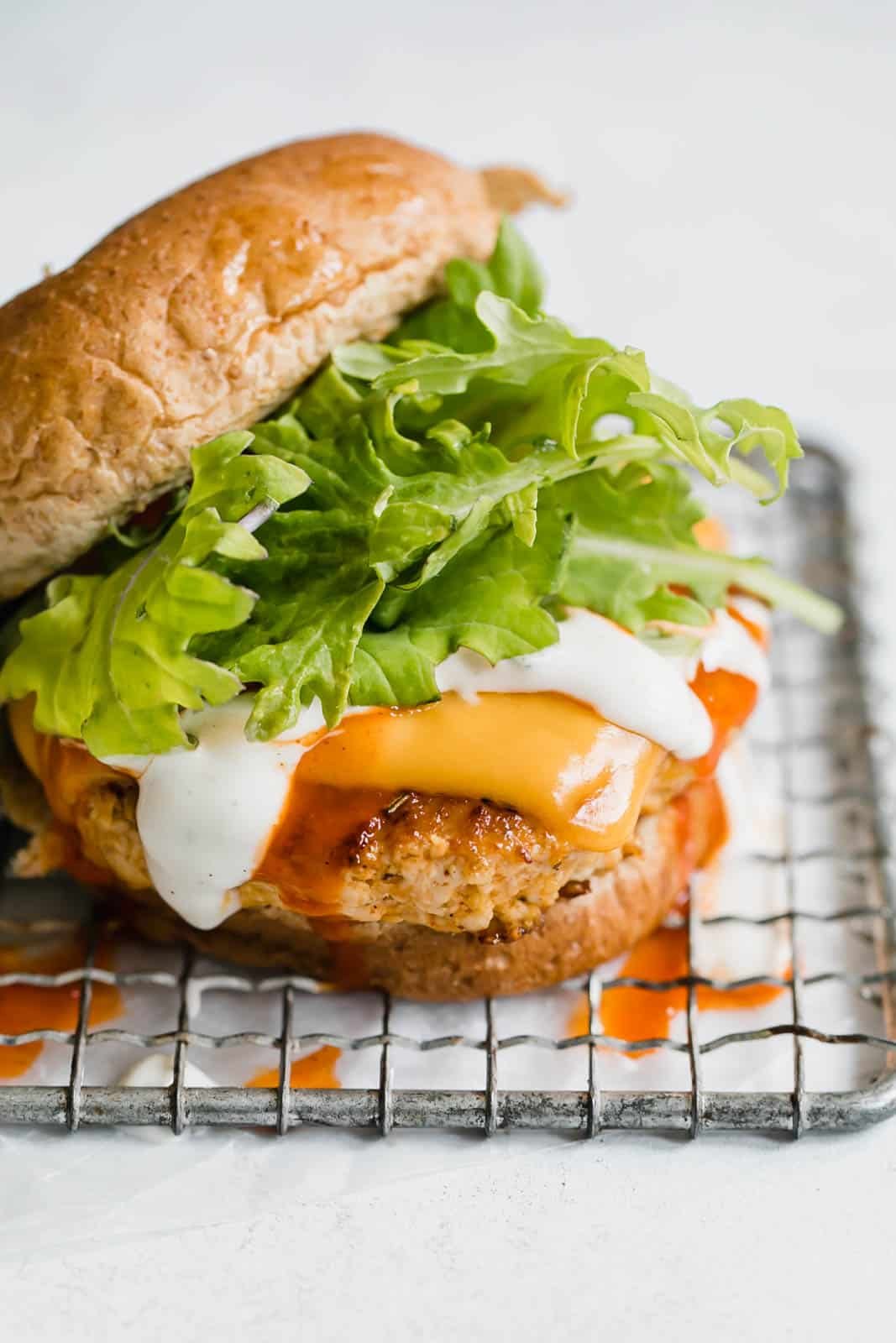 buffalo chicken burgers I howsweeteats.com #buffalo #chicken #burgers