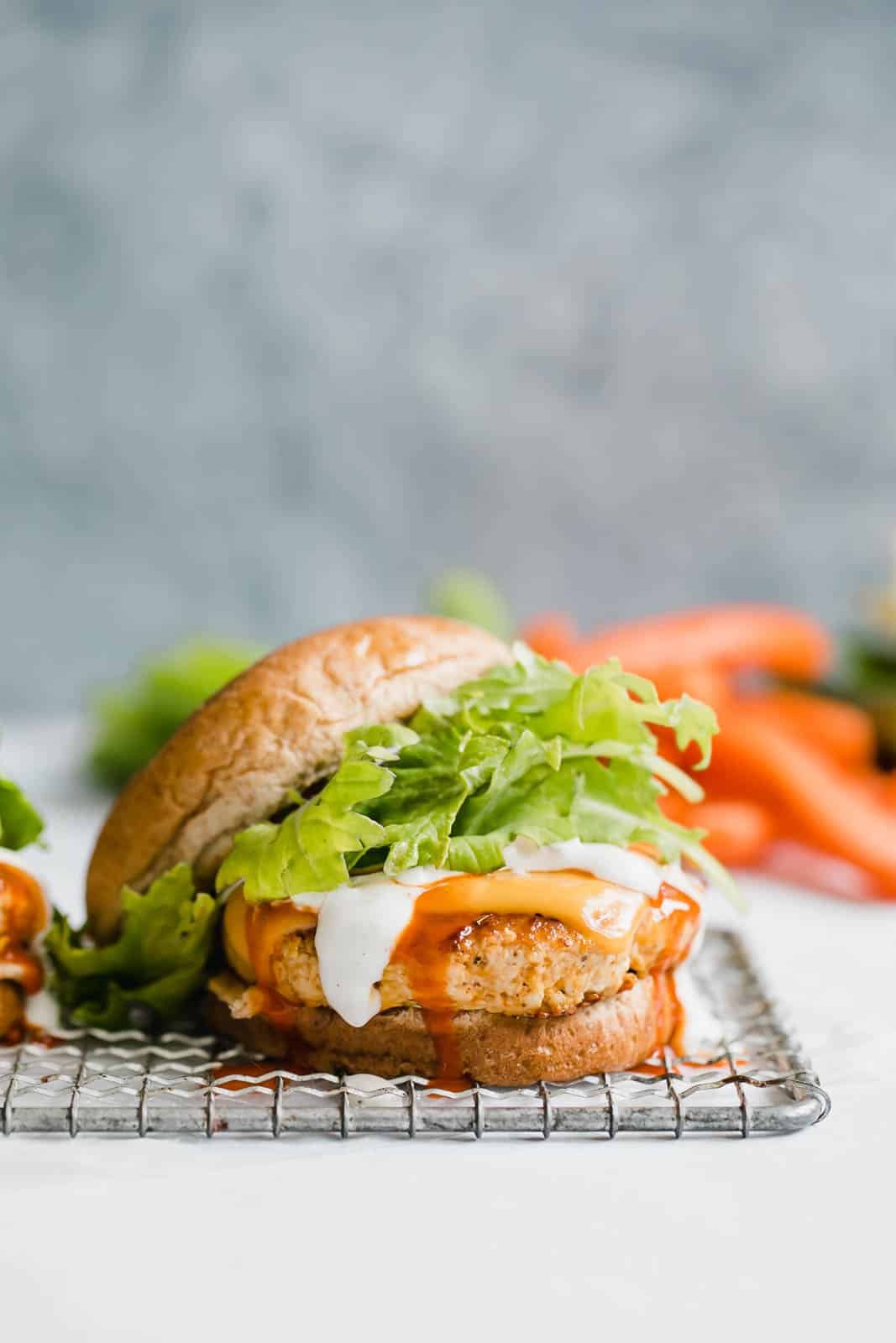 buffalo chicken burgers I howsweeteats.com #buffalo #chicken #burgers