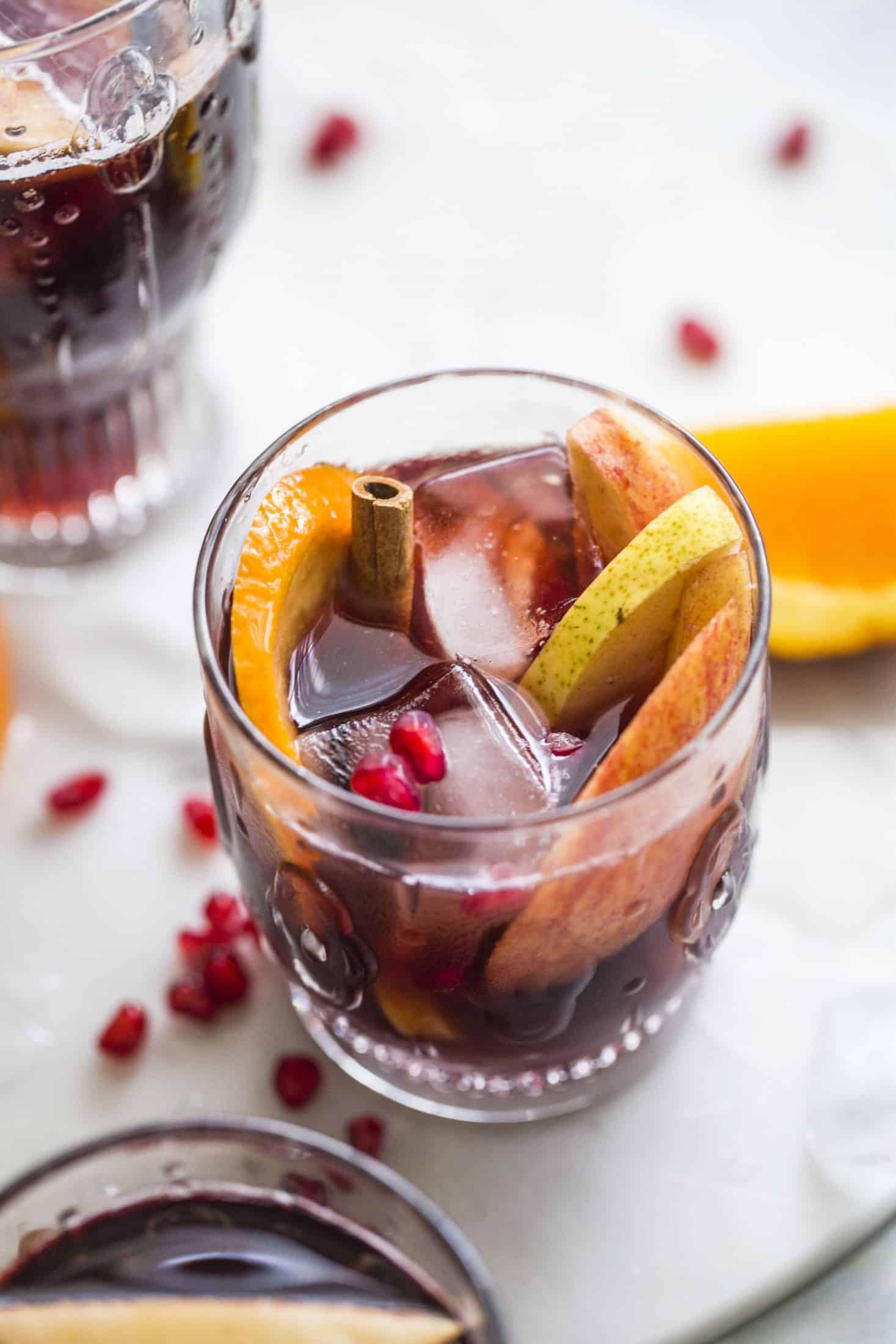 Pomegranate sangria is the best winter sangria ever! It comes in the form of delicious pomegranate vanilla sangria with lots of red wine and brandy. It's perfect for the cooler months and it will warm you right up. I howsweeteats.com #pomegranate #sangria