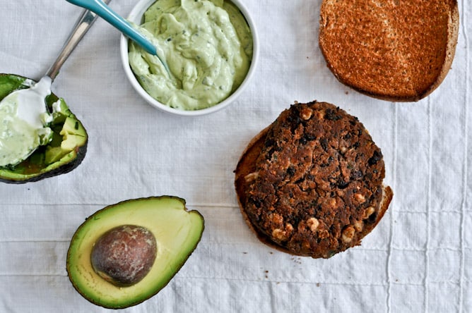 Easy Double Bean Burgers with Avocado Basil Cream I howsweeteats.com Easy Double Bean Burgers with Avocado Basil Cream I howsweeteats.com