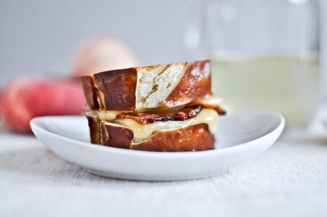 Peach, Bacon + Gouda Grilled Cheese Sliders on Pretzel Bread I howsweeteats.com Peach, Bacon + Gouda Grilled Cheese Sliders on Pretzel Bread I howsweeteats.com