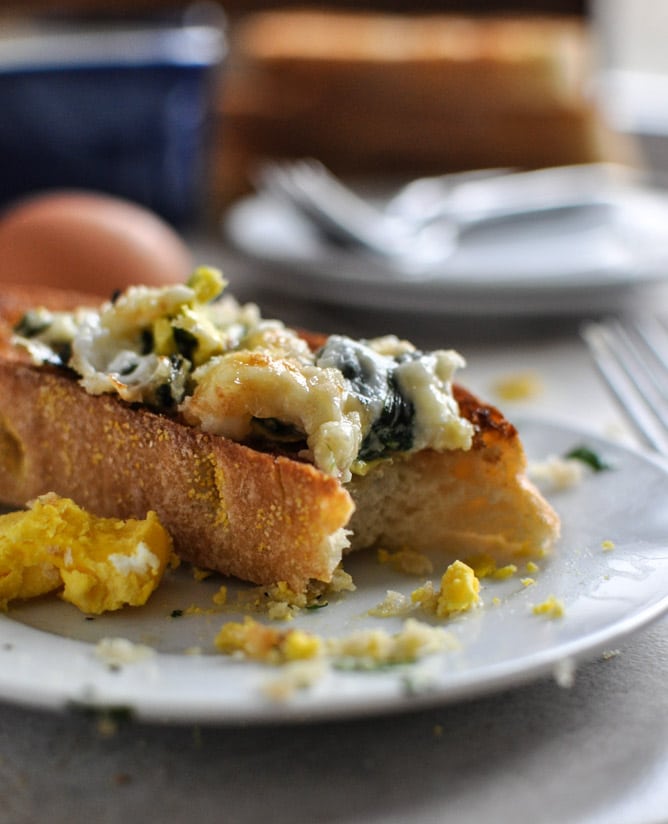Fontina and Spinach Baked Eggs with Garlic Brown Butter Breadcrumbs I howsweeteats.com