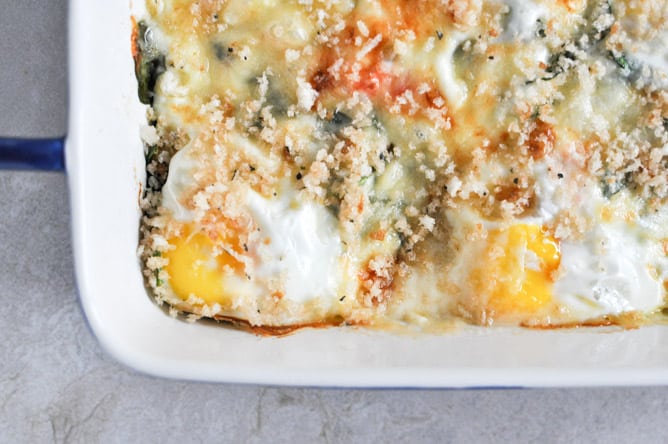 Fontina and Spinach Baked Eggs with Garlic Brown Butter Breadcrumbs I howsweeteats.com