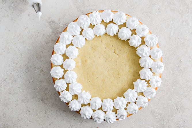 Easy Lemon Cake with Marshmallow Frosting + Toasted Coconut I howsweeteats.com
