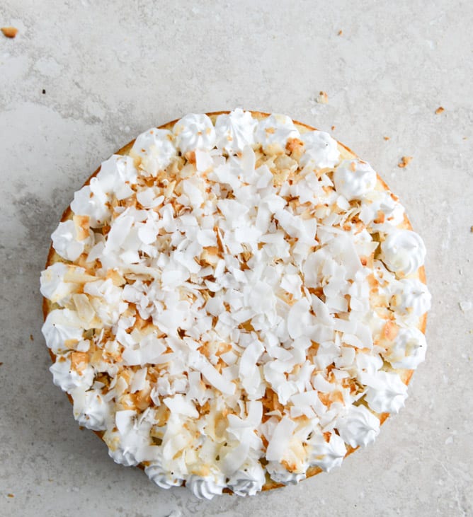Easy Lemon Cake with Marshmallow Frosting + Toasted Coconut I howsweeteats.com