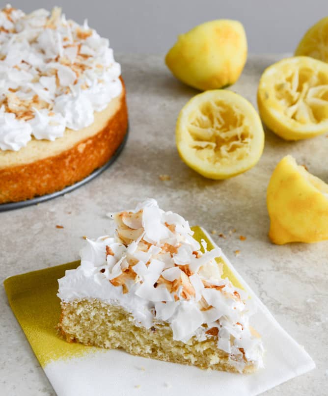 Easy Lemon Cake with Marshmallow Frosting + Toasted Coconut I howsweeteats.com