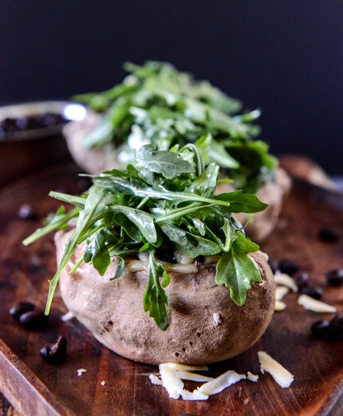 Cheesy Black Bean Stuffed Sweet Potatoes with Arugula + Poached Eggs I howsweeteats.com