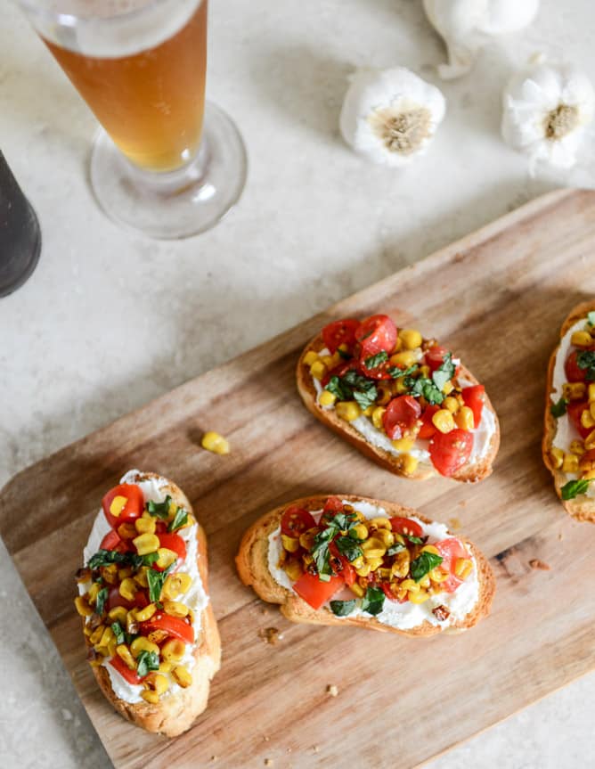 Summer Crostini with Whipped Roasted Garlic Goat Cheese I howsweeteats.com