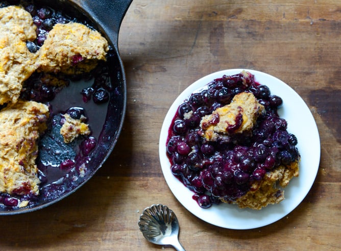 Skillet Blueberry Cobbler with a Cheddar Biscuit Crust I howsweeteats.com