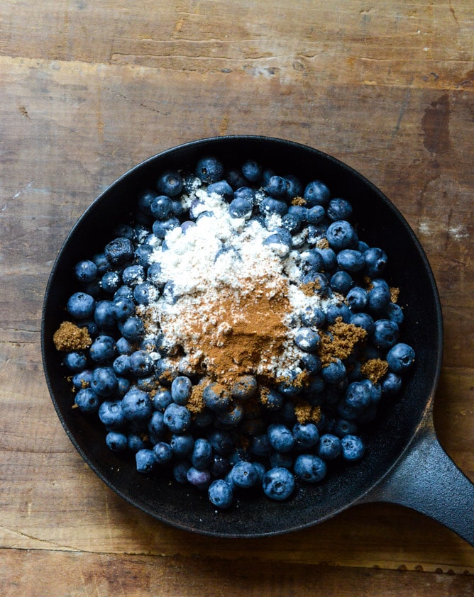 Skillet Blueberry Cobbler with a Cheddar Biscuit Crust I howsweeteats.com
