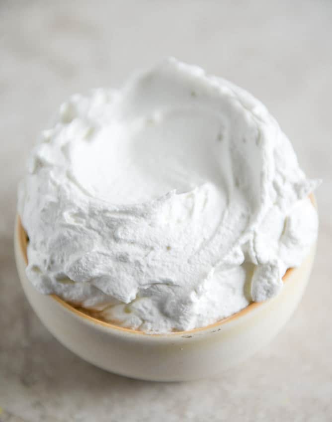 Dark Chocolate Chunk Popovers with Spiked Vanilla Bourbon Whipped Cream I howsweeteats.com