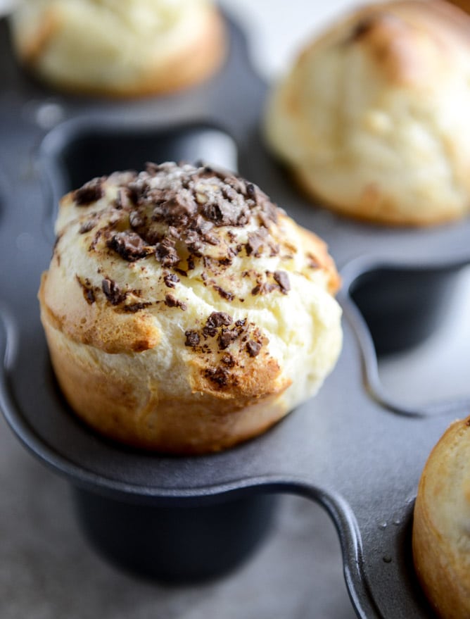 Dark Chocolate Chunk Popovers with Spiked Vanilla Bourbon Whipped Cream I howsweeteats.com