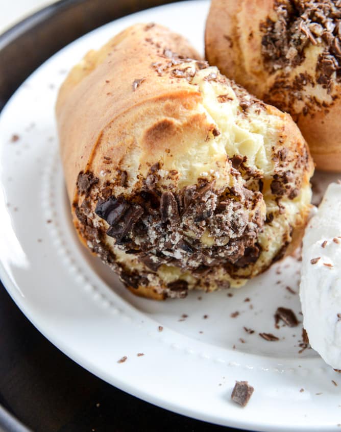 Dark Chocolate Chunk Popovers with Spiked Vanilla Bourbon Whipped Cream I howsweeteats.com