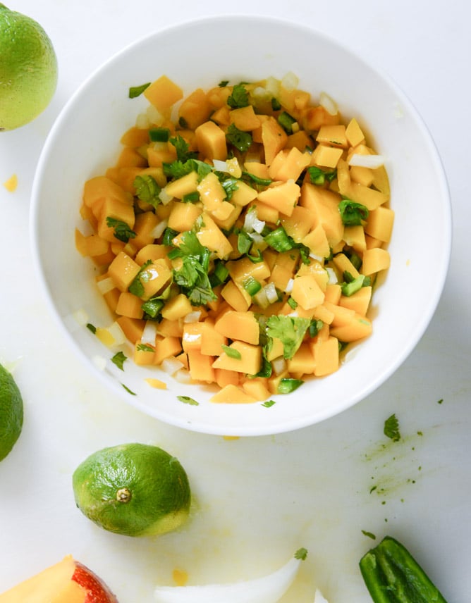 Beer Battered Fish Tacos with Mango Margarita Salsa and Jalapeño Crema I howsweeteats.com