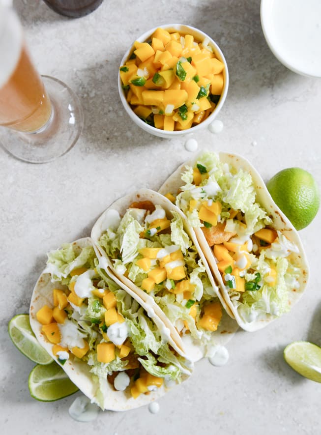 Beer Battered Fish Tacos with Mango Margarita Salsa and Jalapeño Crema I howsweeteats.com