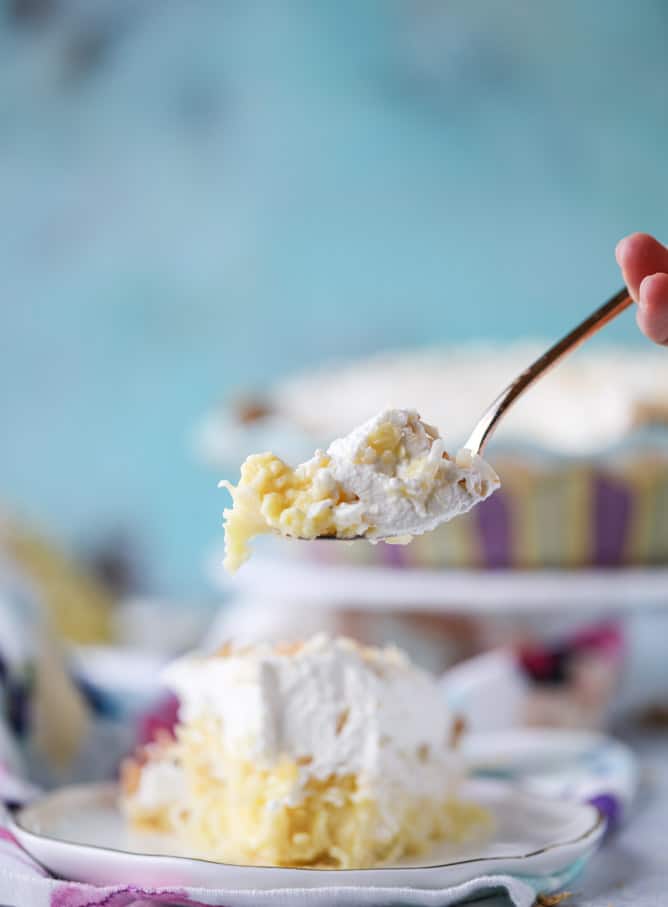 coconut custard pie with coconut whipped cream I howsweeteats.com