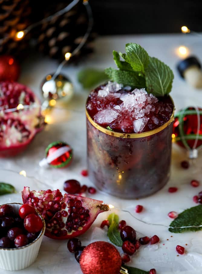 cranberry pomegranate juleps I howsweeteats.com #cocktails #christmas #cranberry #pomegranate #mintjulep