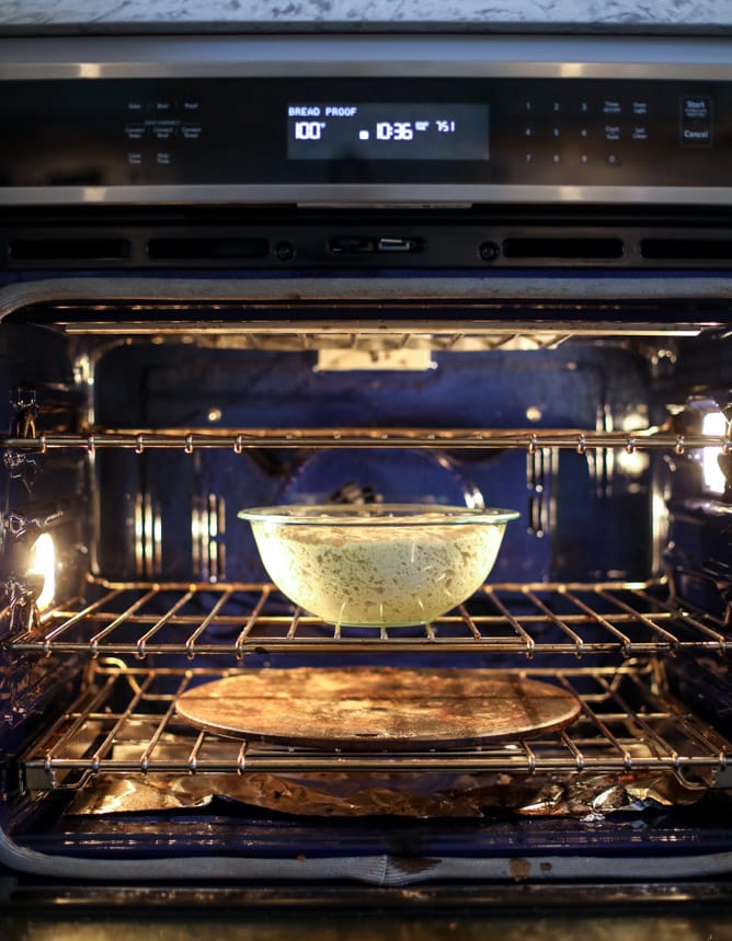 slow roasted cherry tomato pizza with garlic cream and arugula I howsweeteats.com #pizza #recipes