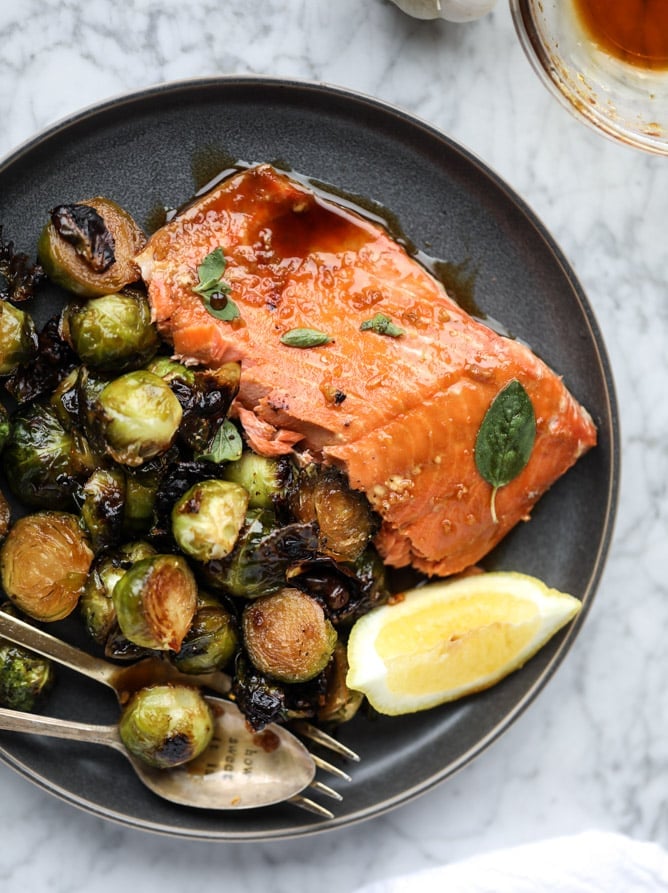 sheet pan honey garlic salmon and brussels I howsweeteats.com #sheetpan #salmon #honeygarlic #brusselssprouts