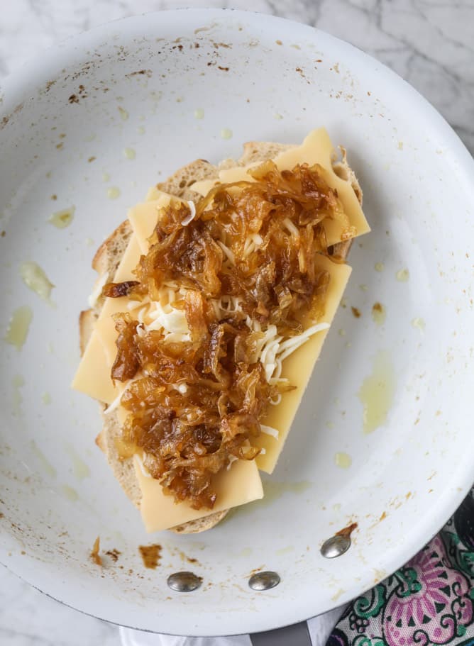 french onion grilled cheese with thyme butter I howsweeteats.com #grilledcheese #caramelizedonion #vegetarian