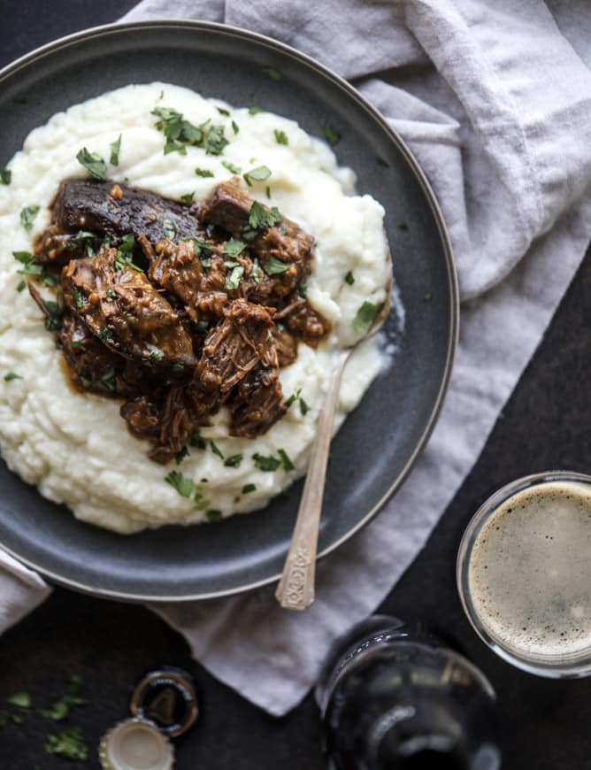 guinness short ribs with cheesy cauliflower mash I howsweeteats.com #slowcooker #guinness #shortribs #saintpatricksday #cauliflower