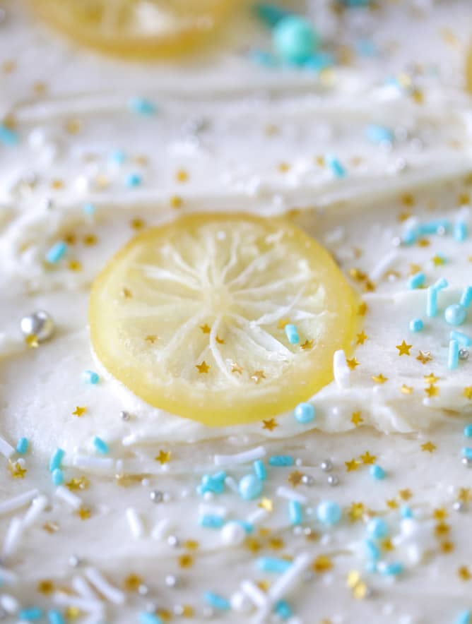 lemon sheet cake with cream cheese frosting I howsweeteats.com #lemon #cake #sheetcake #dessert #creamcheesefrosting