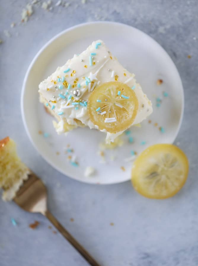 lemon sheet cake with cream cheese frosting I howsweeteats.com #lemon #cake #sheetcake #dessert #creamcheesefrosting