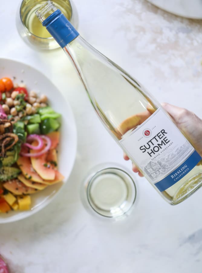 This spicy rainbow salad is chock full of gorgeous, fresh produces, chickpeas, plantains and herbs for one beautiful sight in a bowl. The rainbow salad is satisfying, filling, delicious with a touch of sweet and slightly spicy - everything you want in a meal! I howsweeteats.com #spicy #rainbow #salad 