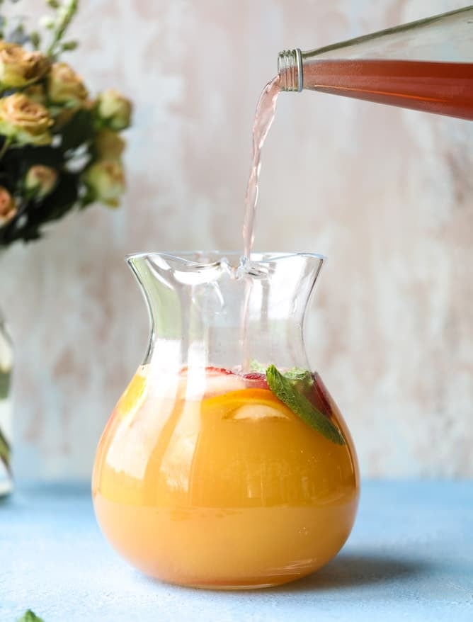 minted mimosa punch I howsweeteats.com #mimosa #punch #orangejuice #cocktails #champagne