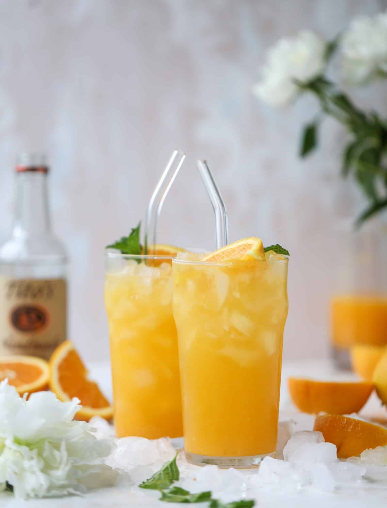This orange crush is a copycat cocktail from the ones served in Ocean City, Maryland at the beach all summer long! It's one entire freshly squeezed orange with vodka and lemon lime soda and it tastes like heaven. Super refreshing and perfect for summer. I howsweeteats.com #orange #crush #cocktail #ocean #city #vodka