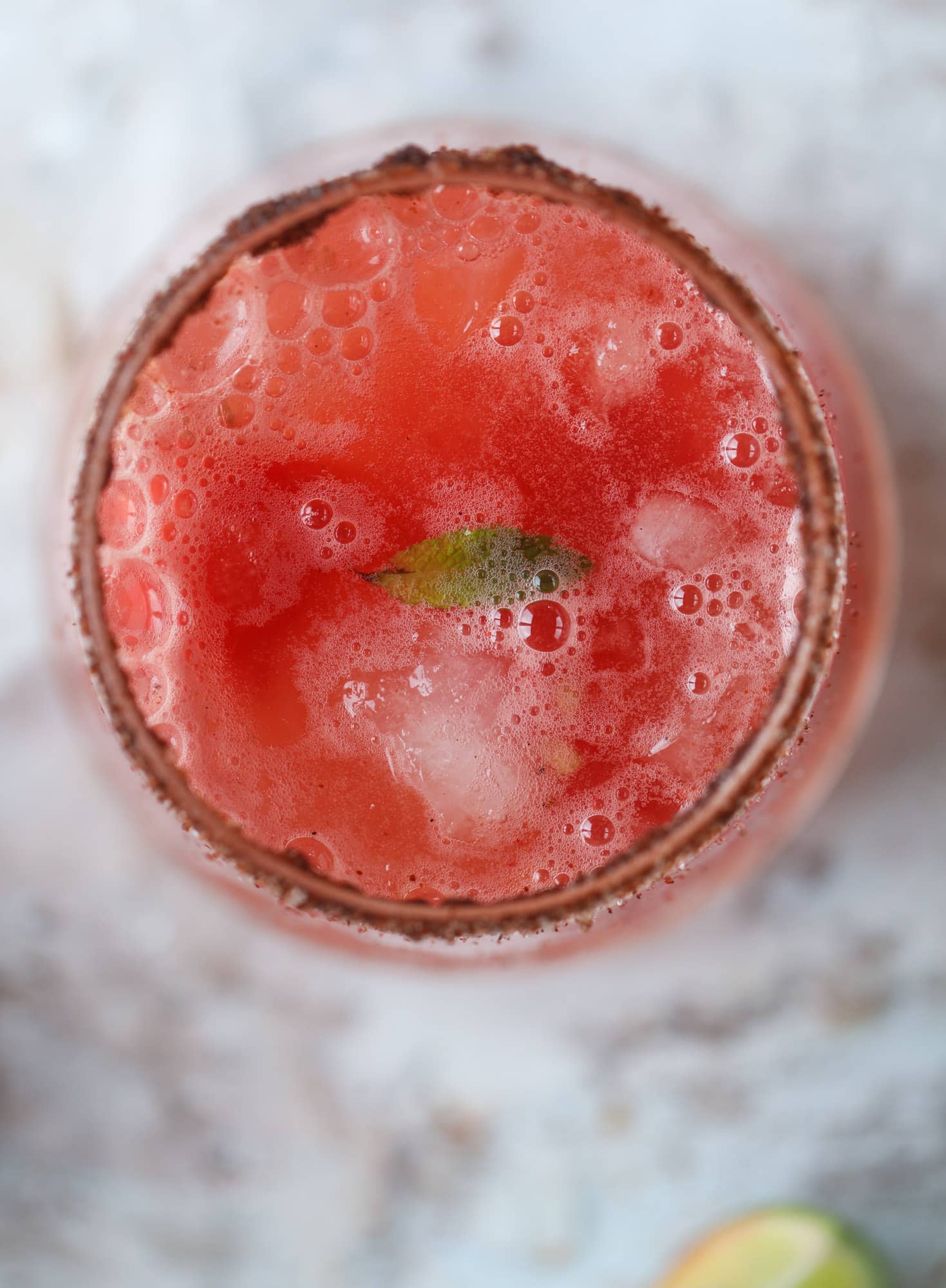 This spicy watermelon sangria is super refreshing, light, delicious and perfect for a hot summer day! Complete with an entire bottle of rosé, watermelon juice, melon balls, strawberries and brandy, this is the best summer cocktail in a pitcher! I howsweeteats.com #spicy #watermelon #sangria #cocktails #rosé