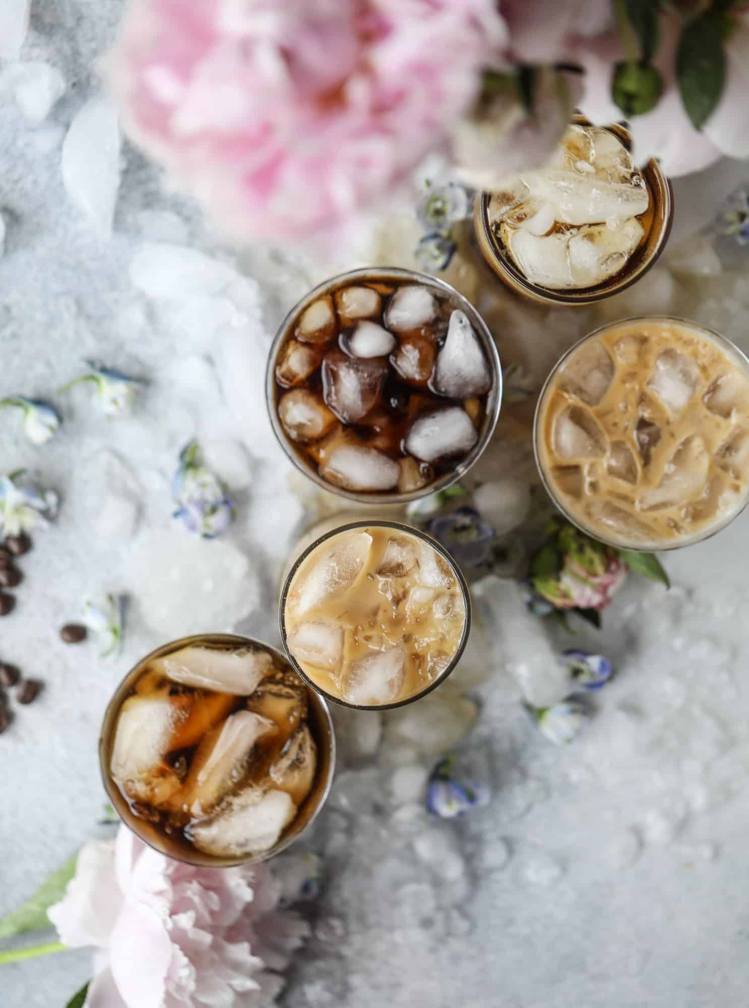 This iced coffee soda is so perfect for summer! Rich coconut syrup, cold brew coffee, cream (or coconut cream!) if you'd like it and lots of bubbly soda. Tastes refreshing, feels like a cocktail and still gives you a pick-me-up! I howsweeteats.com #iced #coffee #soda #coconut