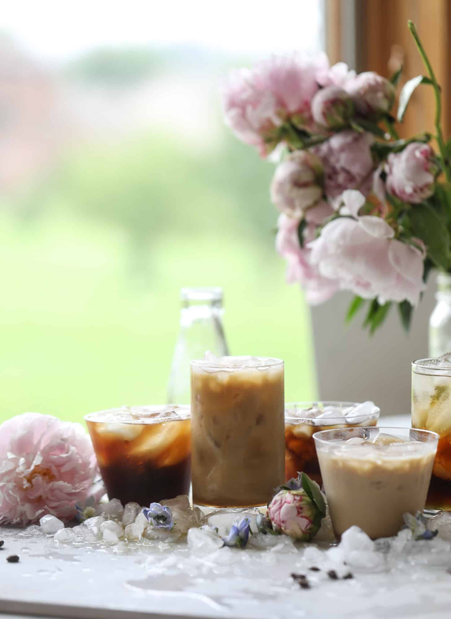This iced coffee soda is so perfect for summer! Rich coconut syrup, cold brew coffee, cream (or coconut cream!) if you'd like it and lots of bubbly soda. Tastes refreshing, feels like a cocktail and still gives you a pick-me-up! I howsweeteats.com #iced #coffee #soda #coconut