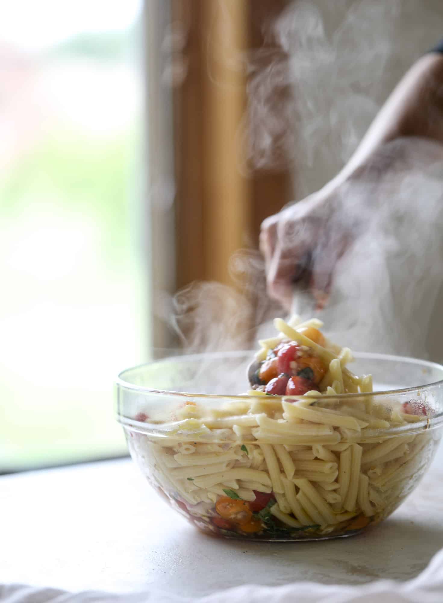 This bruschetta chicken is the perfect summer garden meal! Juicy, flavorful chicken topped with fresh tomatoes, garlic, basil and balsamic glaze, along with a touch of cheese. Served with pasta, it's an incredible meal. I howsweeteats.com #bruschetta #chicken #pasta #tomatoes #basil 