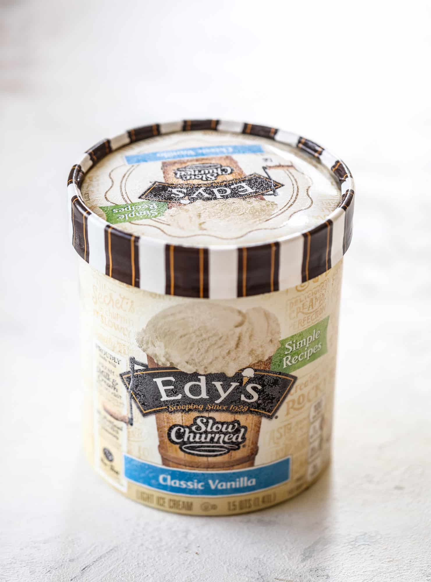 This peanut butter fudge ice cream cake is absolutely insane and perfect for summer! A sweet and savory pretzel crust, vanilla ice cream, homemade hot fudge and a peanut butter whipped cream layer take it to the next LEVEL. Delicious! I howsweeteats.com #icecream #cake #peanutbutter #chocolate #pretzel