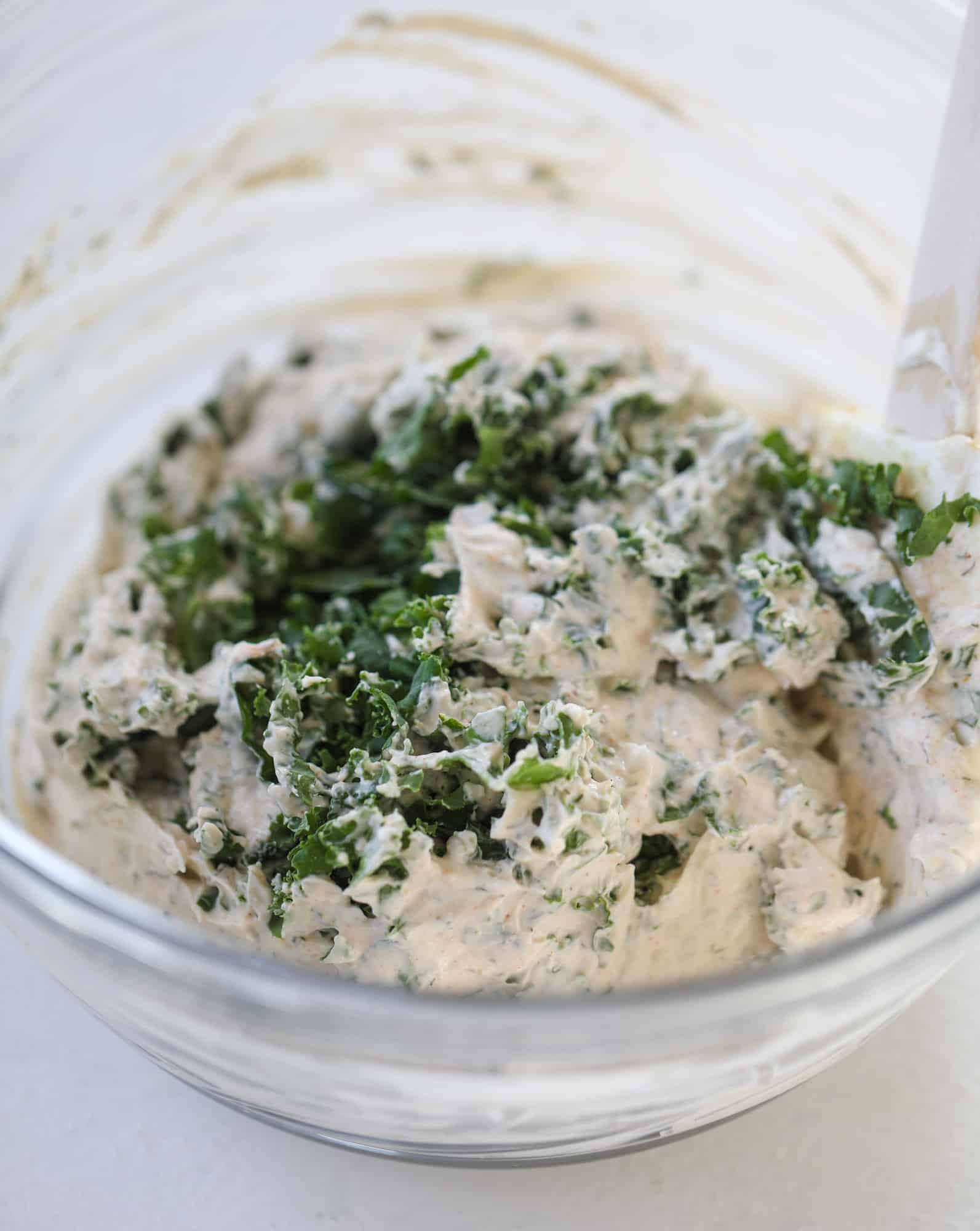 This greek yogurt ranch dip is fabulous for a summertime pool tip and it's full of greens! Made with a homemade ranch spice seasoning, lots of shredded greek kale and greek yogurt, it's the perfect dip for crudite or chips! I howsweeteats.com #kale #greek #yogurt #ranch #dip #healthy #snacks