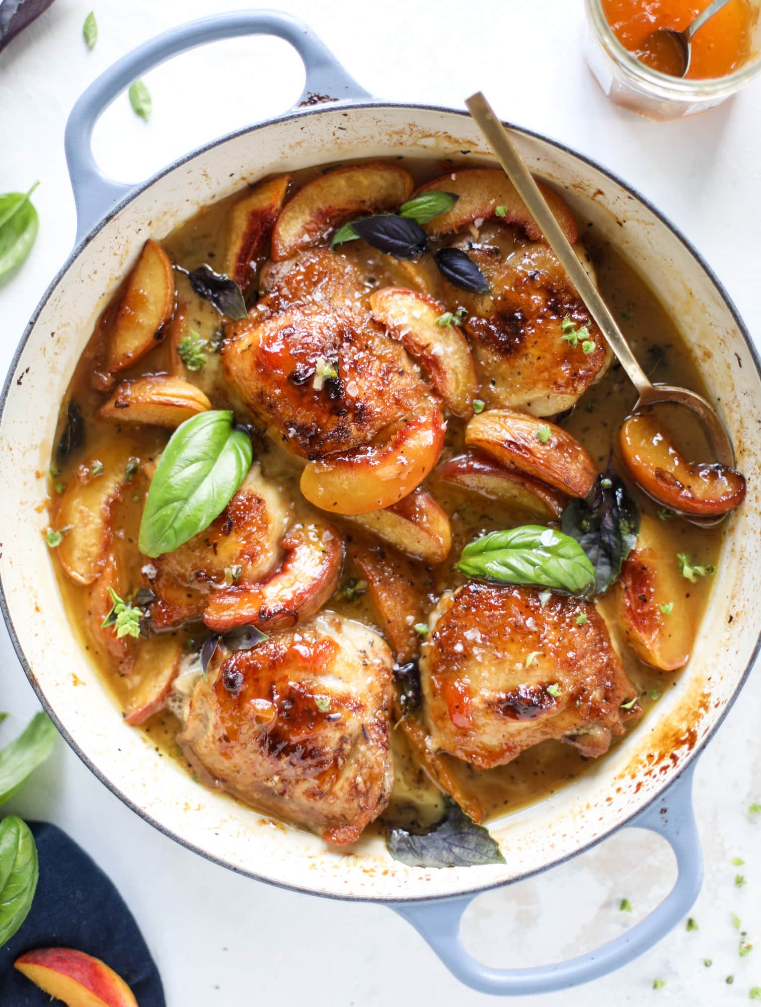 This amazing summertime one pot chicken is made with fresh peaches and basil and takes no time at all. The sweet and savory combination is perfect for a quick weeknight meal; the sauce is amazing for dipping and the chicken is flavorful as can be. I howsweeteats.com #chicken #peach #basil #easy #dinner #recipe #summer #healthy