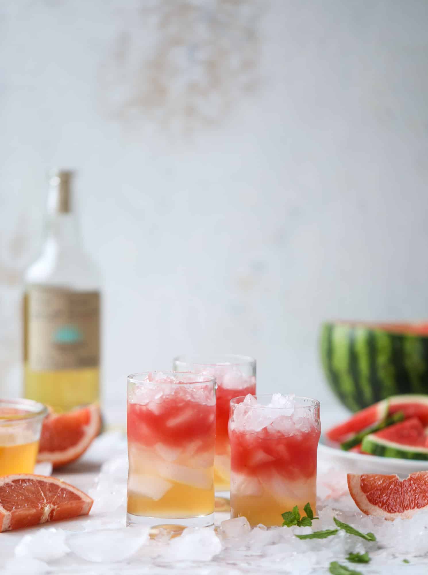 This watermelon grapefruit paloma cocktail is a summertime dream! Grapefruit syrup is super easy to make and when it's combined with fresh watermelon juice and tequila... oooh! Best happy hour ever. I howsweeteats.com #grapefruit #watermelon #paloma #cocktail #tequila