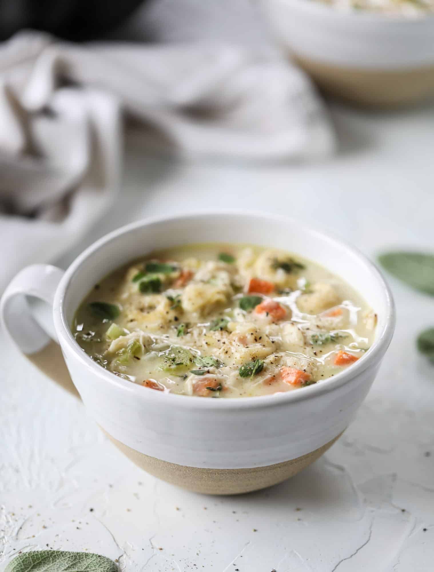 This creamy chicken tortellini soup is the perfect weeknight meal! It comes together quickly and is a great meal to use up a rotisserie chicken. It's satisfying and hearty, with tortellini replacing egg noodles for the pasta. Comfort food perfection! I howsweeteats.com #chicken #soup