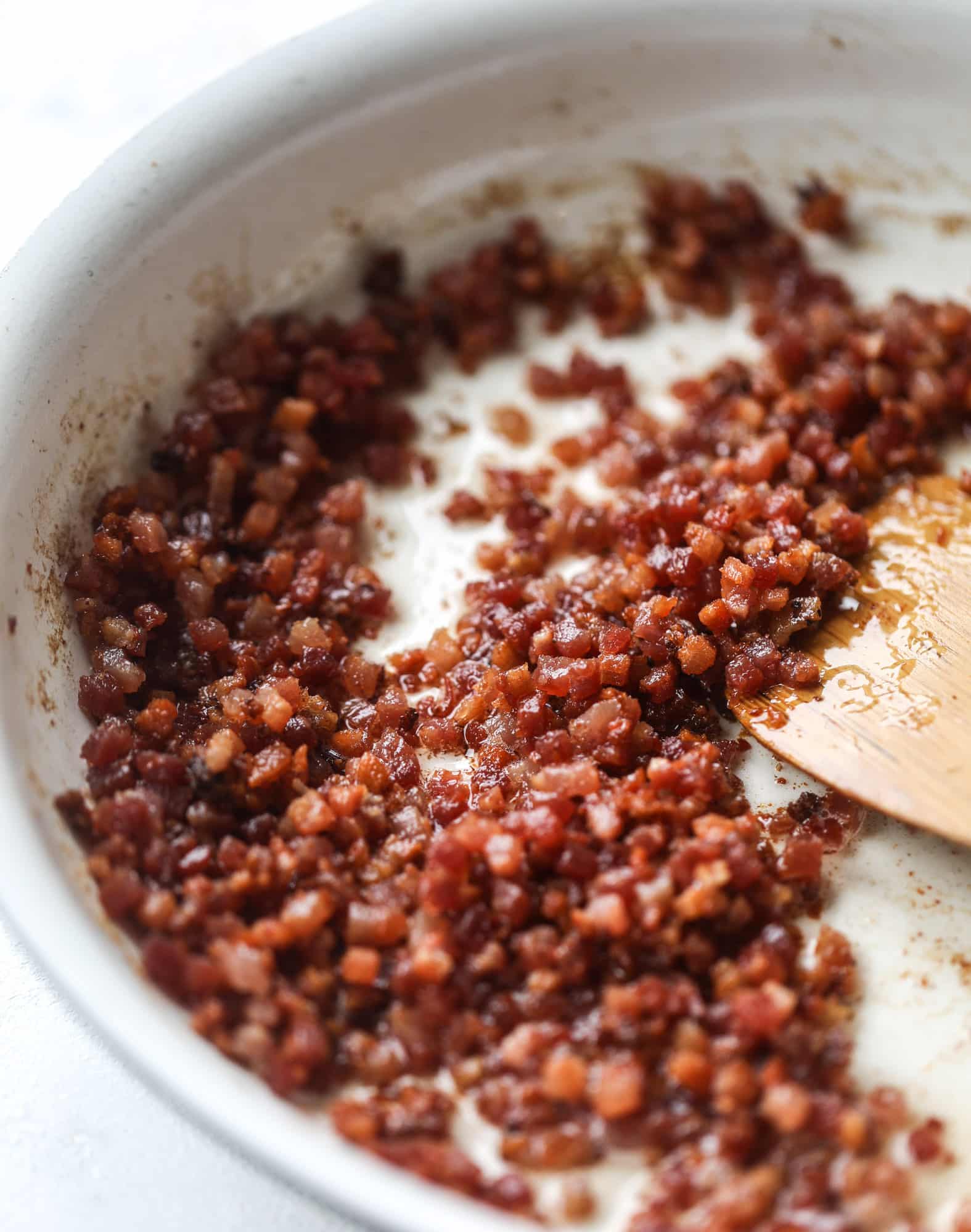 This fall kale salad is perfect for the season and full of so much delicious flavor! Shredded kale, honeycrisp apple, fresh figs, pancetta, pickled onions, pecans and goat cheese come together with a maple cider vinaigrette for salad heaven. I howsweeteats.com #fall #kale #salad #apples #figs #pecans