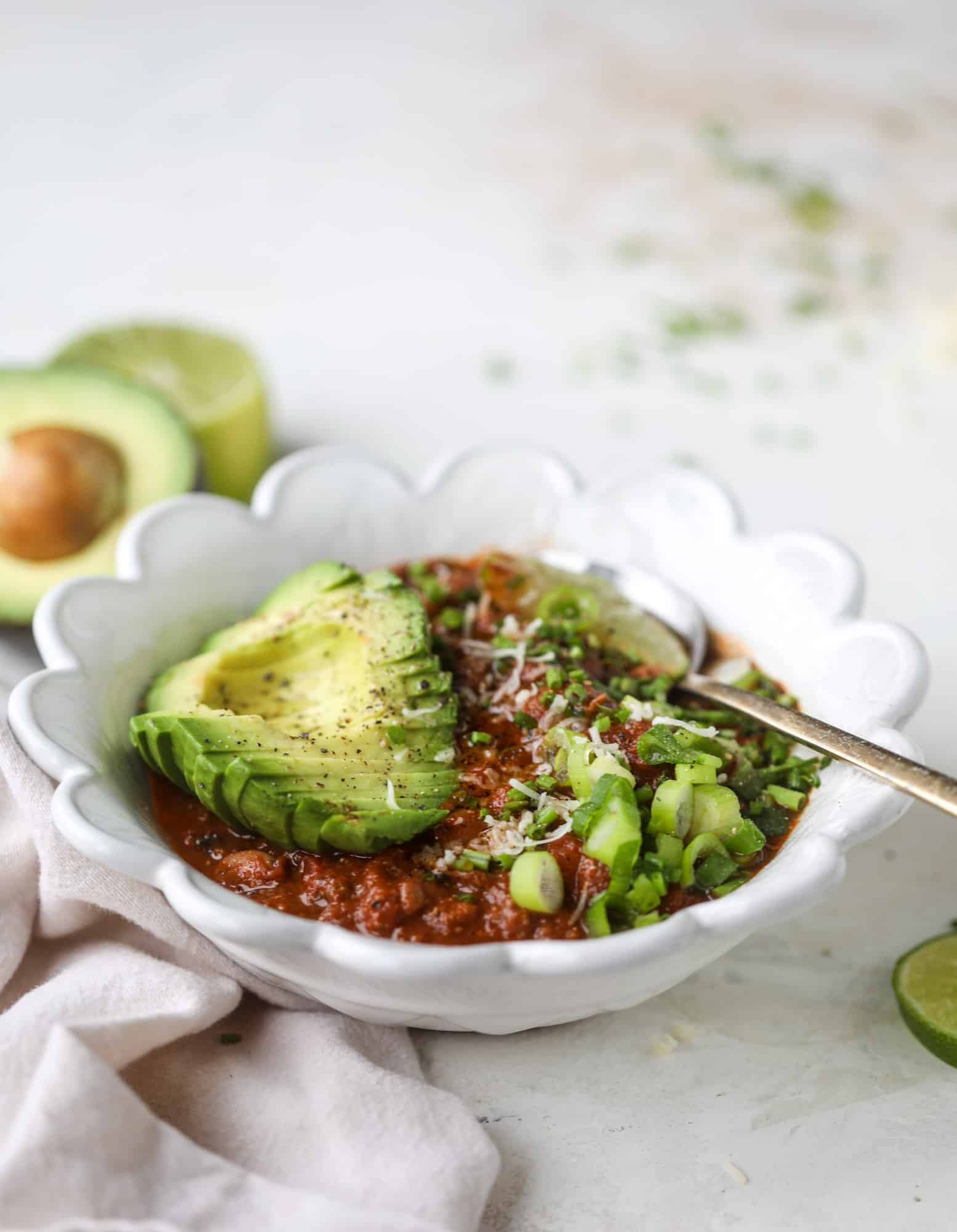 This fire and ice chili has a secret ingredient that makes it rich, velvety and insanely delicious. Dark chocolate ice cream is stirred in before serving and adds a crazy depth of flavor while bringing so much richness to your favorite bowl. You have to try it! I howsweeteats.com #chili #recipe #ice #cream #chili #bar