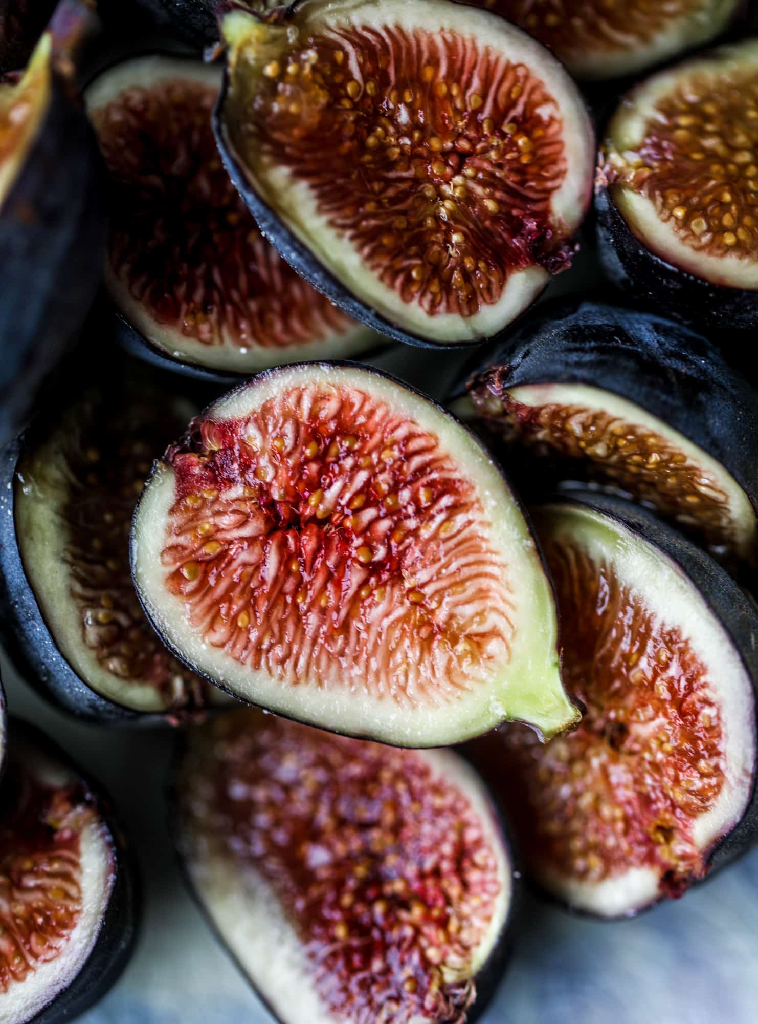 This cinnamon sugar toast is an absolutely dream! It's spread with a cinnamon brown sugar butter, grilled to perfection and served with creamy whipped ricotta cheese, fresh figs, honey, cinnamon and sliced almonds. I howsweeteats.com #cinnamon #sugar #toast #ricotta #figs #breakfast