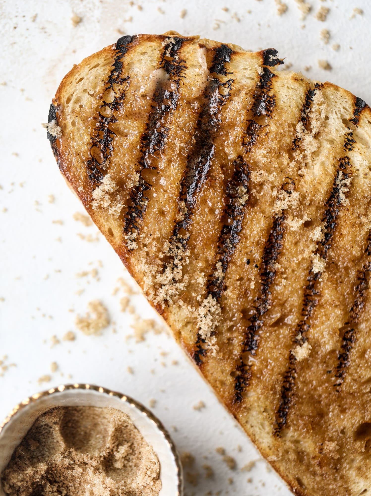This cinnamon sugar toast is an absolutely dream! It's spread with a cinnamon brown sugar butter, grilled to perfection and served with creamy whipped ricotta cheese, fresh figs, honey, cinnamon and sliced almonds. I howsweeteats.com #cinnamon #sugar #toast #ricotta #figs #breakfast