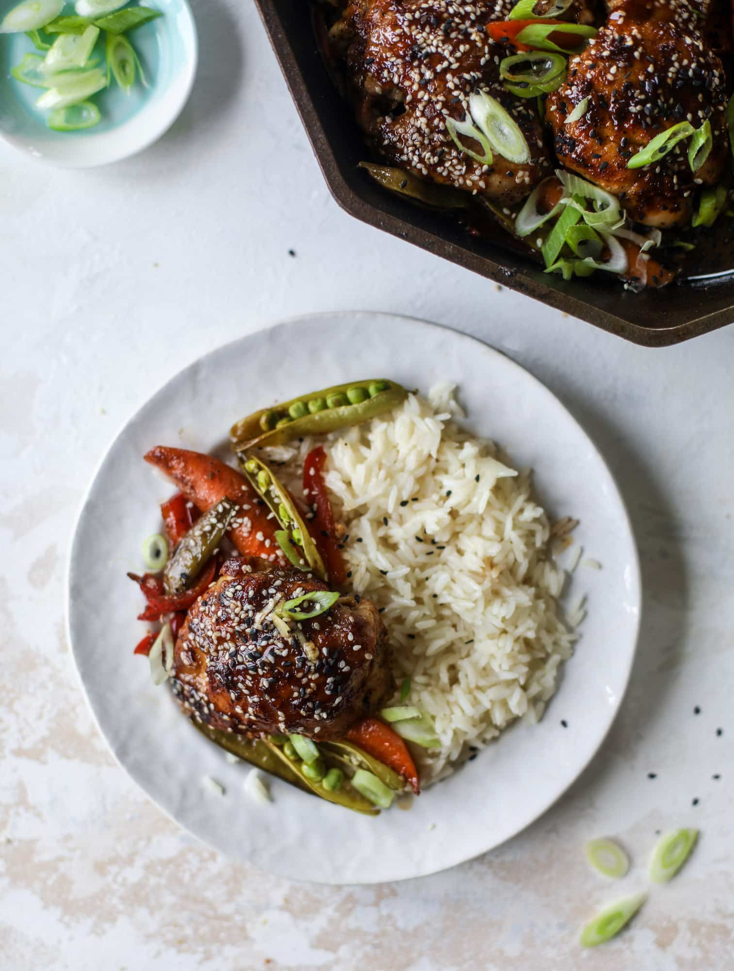 This one pan sesame chicken and veggies is so easy and delicious! It's the perfect weeknight meal that is packed with flavor. The chicken and veggies are great on their own but also wonderful when paired with brown rice or quinoa! I howsweeteats.com #one #pan #sesame #chicken #dinner #easy