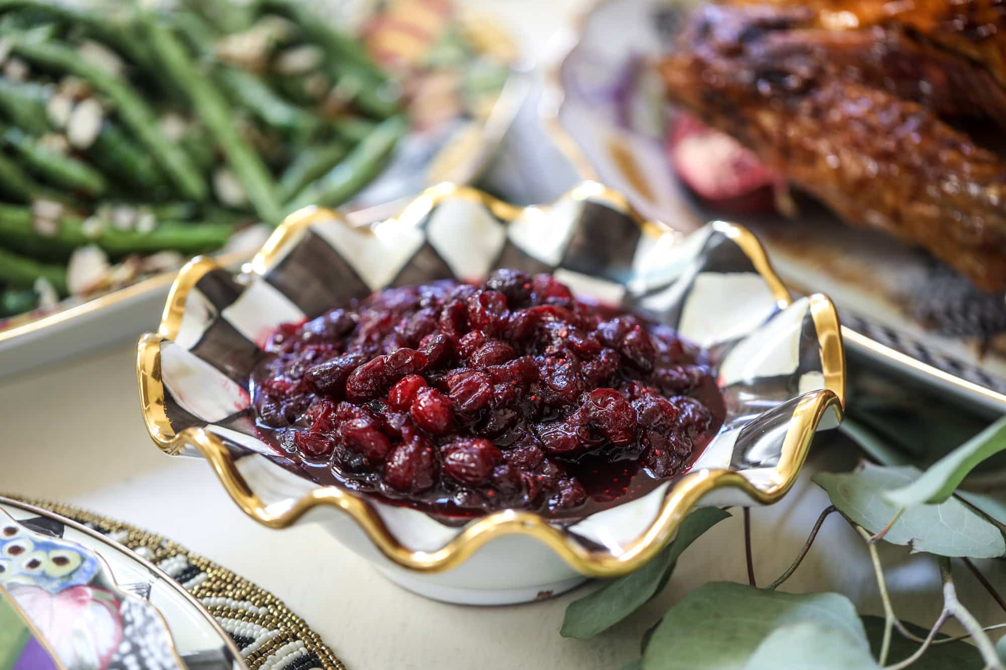 This cranberry chutney is not your traditional Thanksgiving side dish! Chipotle peppers and adobo sauce give this cranberry chutney a little kick - a touch of heat that works so well with the sweet. As a side or spread on sandwiches, it's perfect for the holidays! I howsweeteats.com #cranberry #chutney