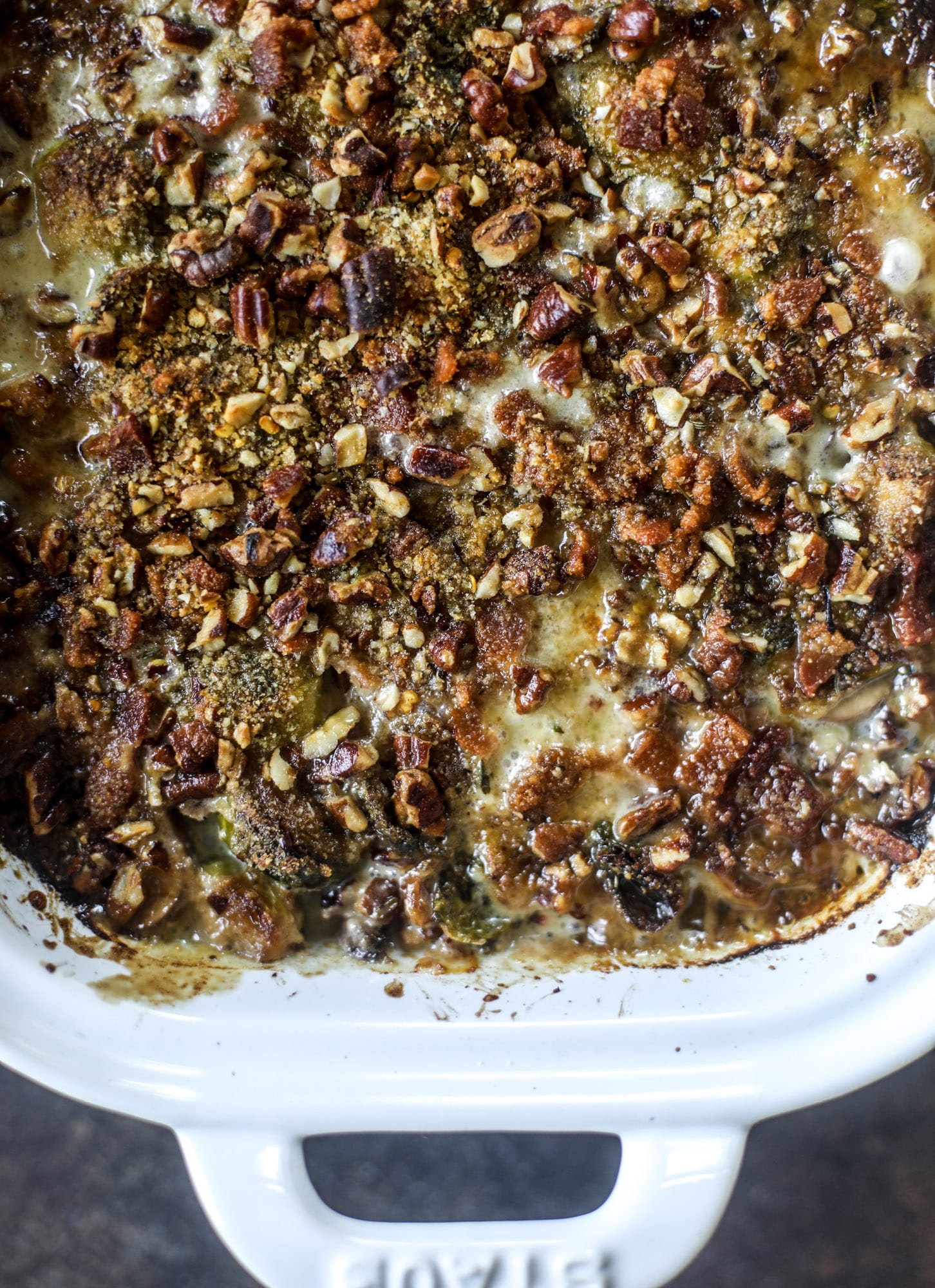 This brussels sprouts gratin is heaven in a dish! It's super flavorful, delicious and comes together to create a fabulous side dish for Thanksgiving or the holidays. Pancetta and cheese turn this in to flavor town - you won't be able to stop eating it! I howsweeteats.com #brusselssprouts #gratin