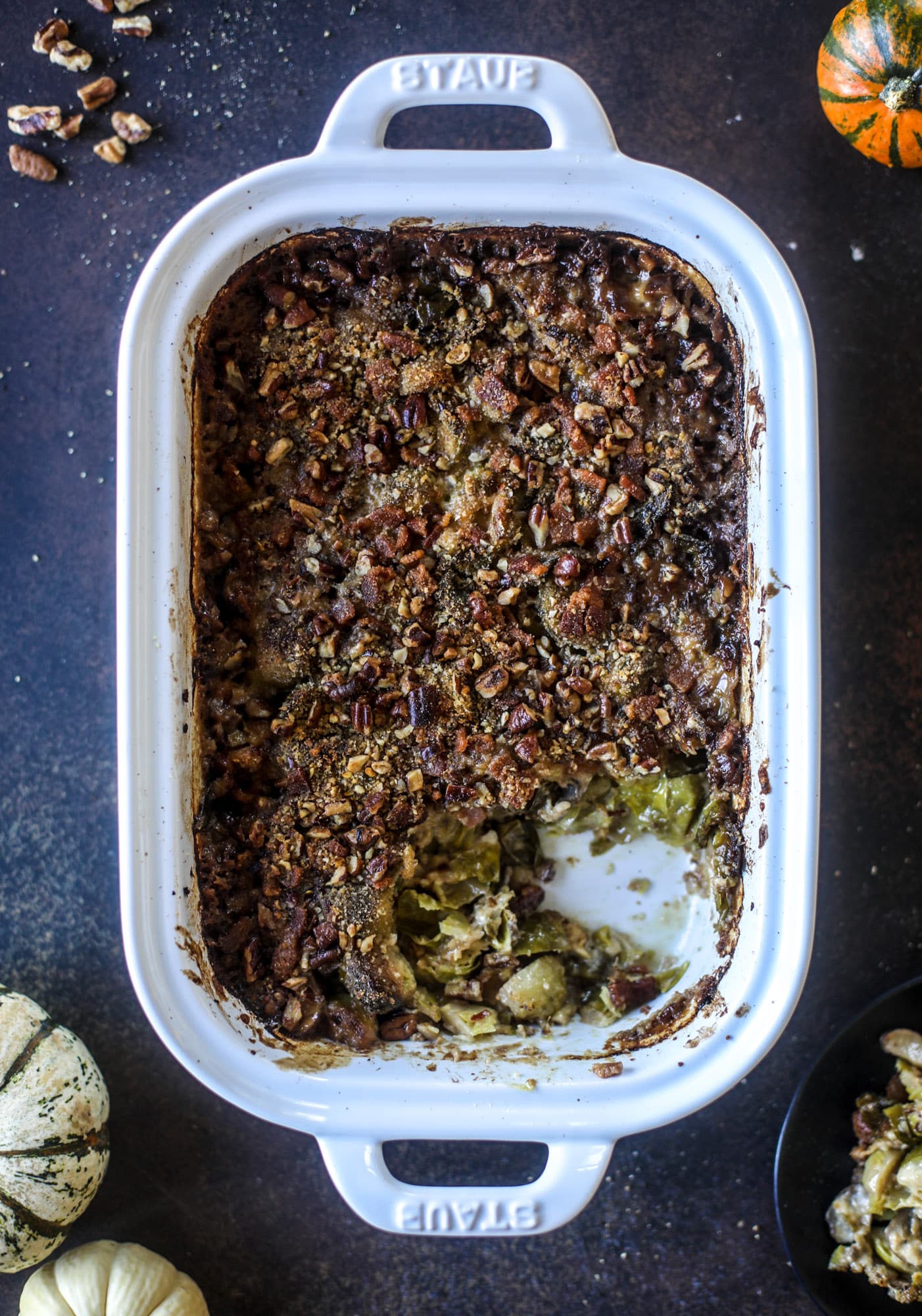 This brussels sprouts gratin is heaven in a dish! It's super flavorful, delicious and comes together to create a fabulous side dish for Thanksgiving or the holidays. Pancetta and cheese turn this in to flavor town - you won't be able to stop eating it! I howsweeteats.com #brusselssprouts #gratin