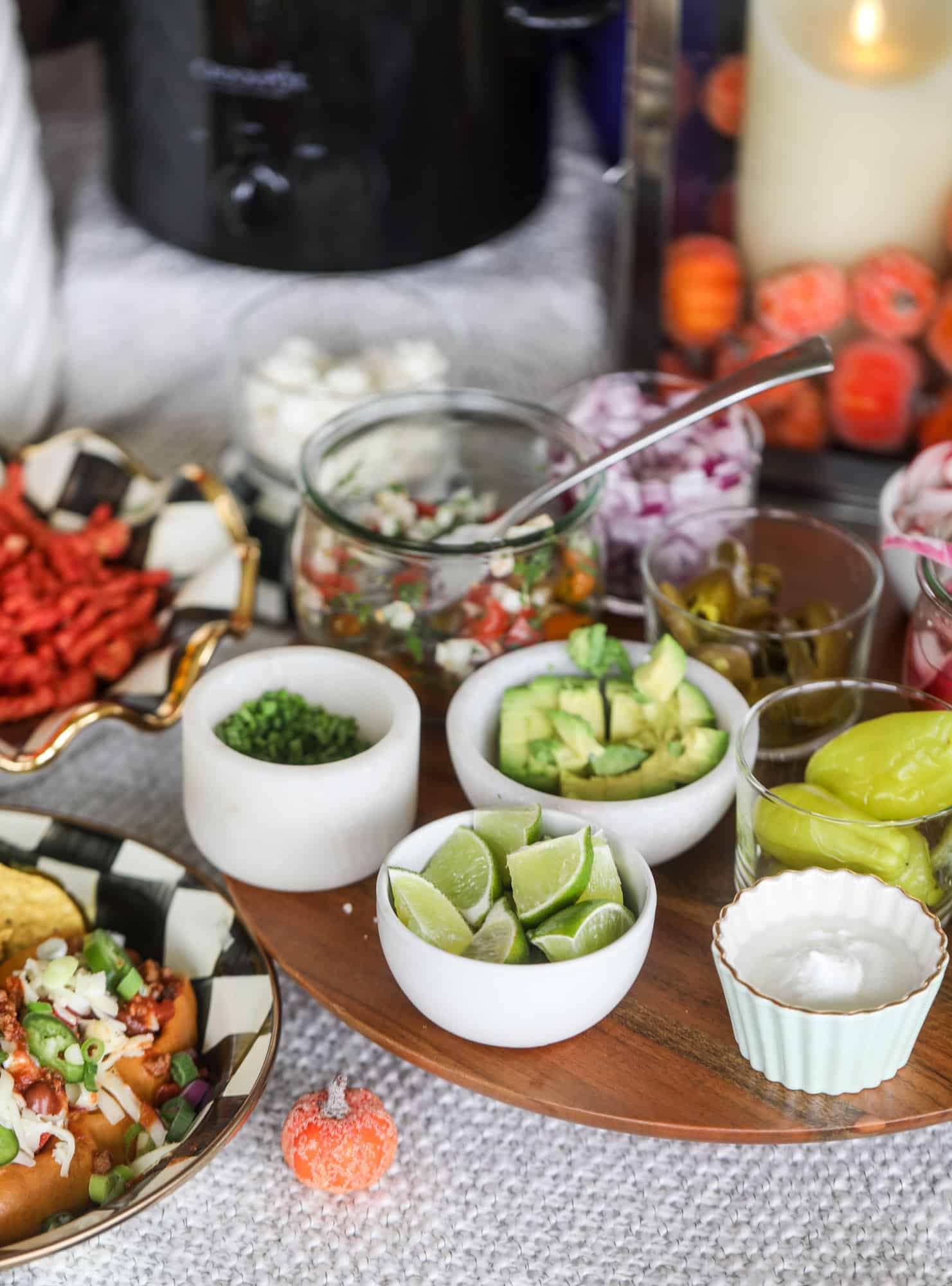 This is the best way to set up a chili bar! All my tips and tricks for setting up a perfect chili bar with multiple toppings, a nacho bar, hot dogs - all done with prep to make the day of the party super easy! This chili bar is goals. I howsweeteats.com #chili #bar #how #to