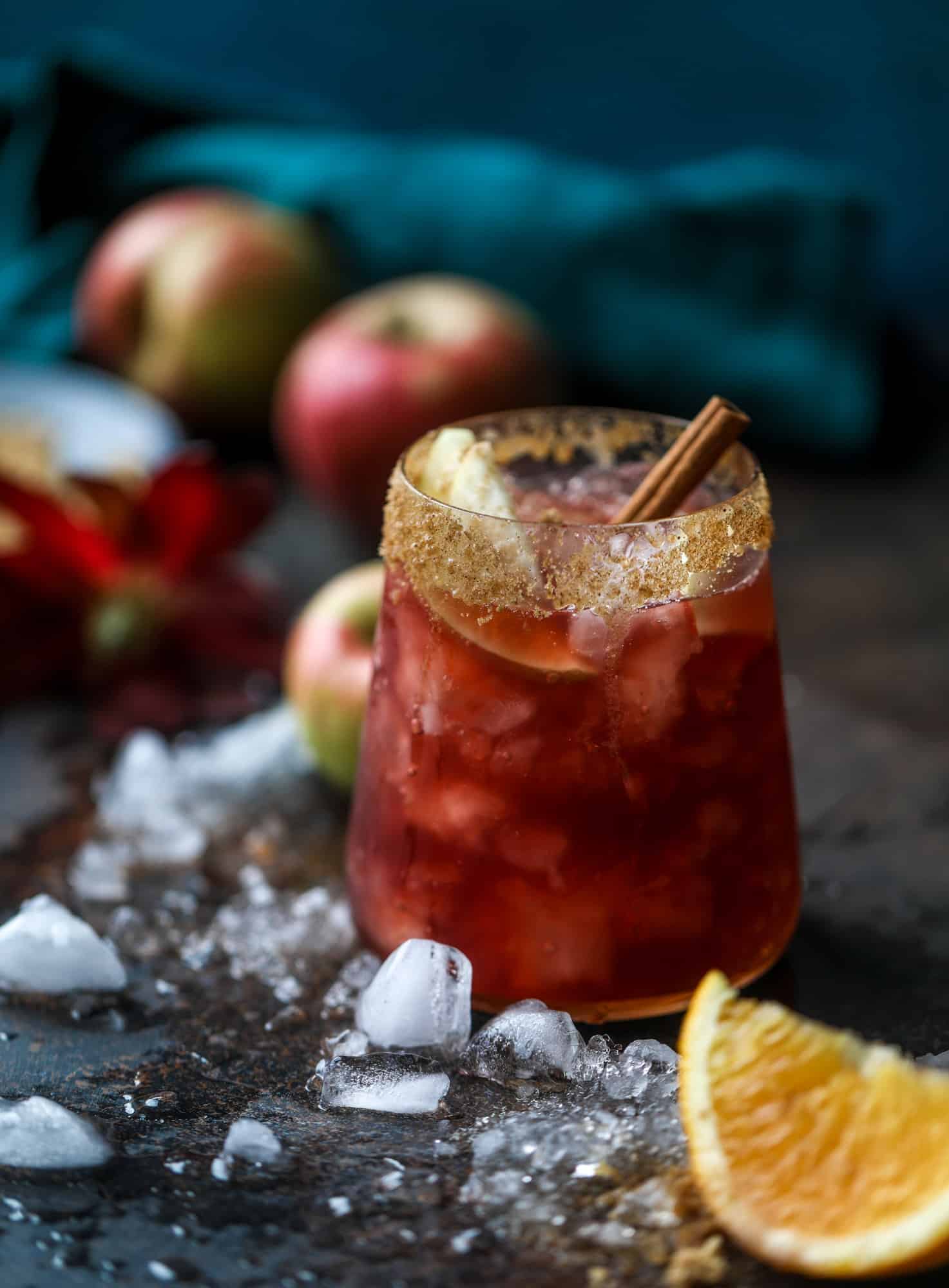 This red apple cider sangria will soon because a staple for your fall! It's delicious and not too sweet, with a base of red wine, apple cider and maple syrup. Cinnamon sticks and apple slices round out the pitcher and it's so flavorful and perfect for the season! I howsweeteats.com #red #apple #cider #sangria 
